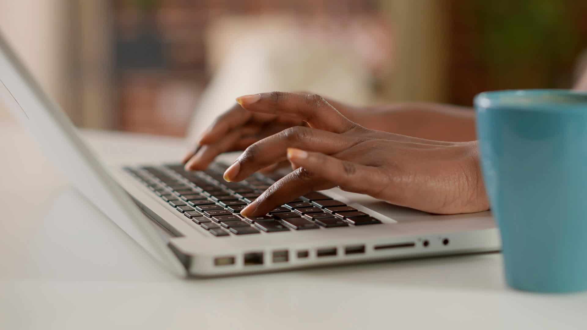 woman typing on laptop